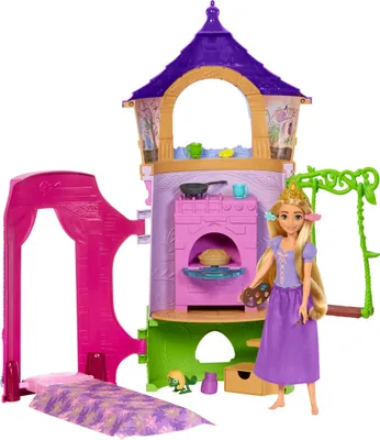 A dollhouse playset with a doll, bed, and accessories, set against a white background.