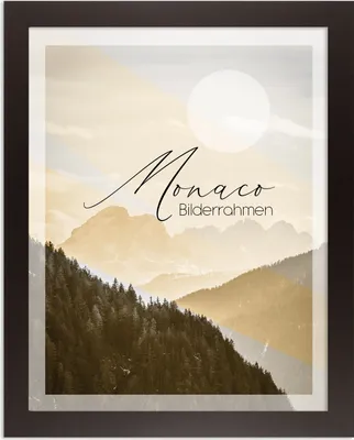A framed picture of mountains with text overlay.