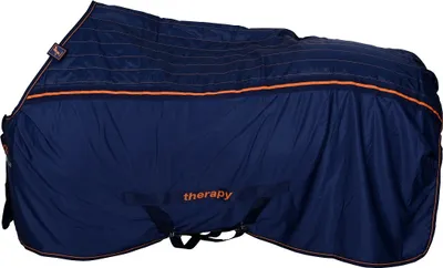 A navy blue horse blanket with orange trim and stitching, folded and lying on a white background.