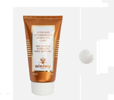 A product shot of a tube of self-tanning lotion next to a dollop of the product.
