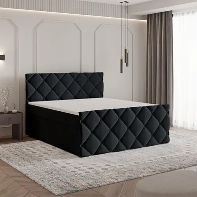 A bedroom setting with a bed as the main focus.
