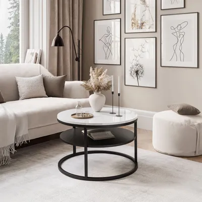 A modern living room scene with a couch, coffee table, and artwork.