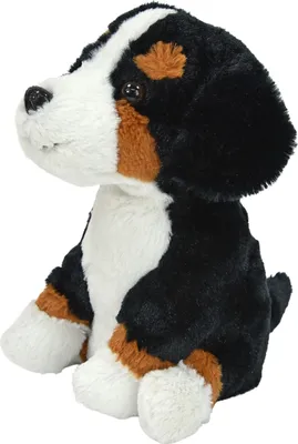 A plush toy dog sitting on a white background.