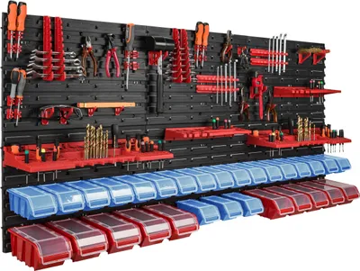 A well-organized tool storage system mounted on a black pegboard, featuring various tools and storage bins.