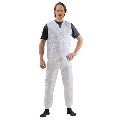 A man is standing and posing in front of a white background wearing a white quilted vest and pants.