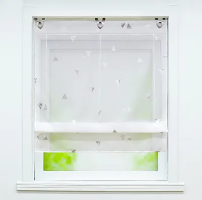 A white Roman blind with a silver triangle pattern hangs in a window.