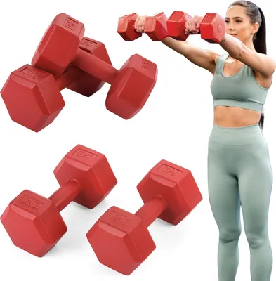 A woman is shown exercising with dumbbells, with several pairs of dumbbells arranged around her.
