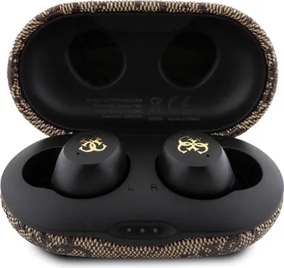 An open charging case for Guess earphones, showing the earphones inside.