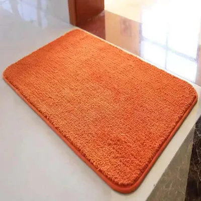 Obrázek produktu pro Protiskuzná, savá, měkká a huňatá podložka do koupelny, oranžová, rozměry 40 x 60 cm