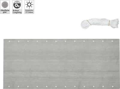 A grey privacy screen with grommets and a bundle of white rope against a white background.