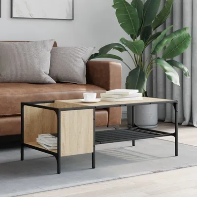 A living room scene with a coffee table, sofa, and plant.