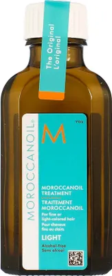 A bottle of Moroccanoil Treatment Light hair product.