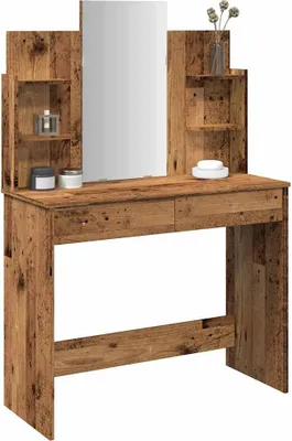 A vanity table with a mirror and shelves.