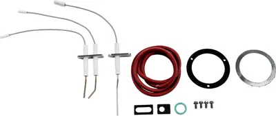 A set of spare parts for a heating system, including igniters, a red hose, gaskets, and screws, laid out on a white background.