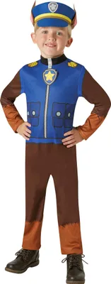 A young boy wearing a Paw Patrol Chase costume, standing against a white background.