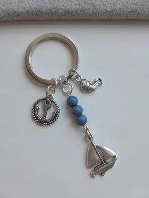 Immagine prodotto di Portachiavi marittimo blu con ancora, barca a vela e pesce