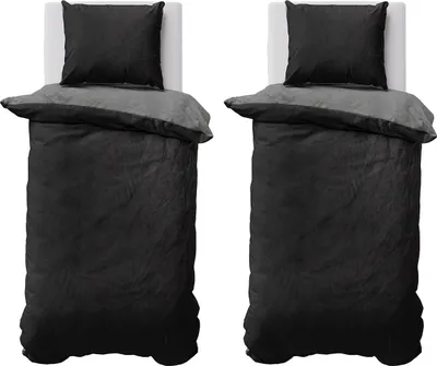 Two identical beds with bedding are shown side-by-side against a white background.