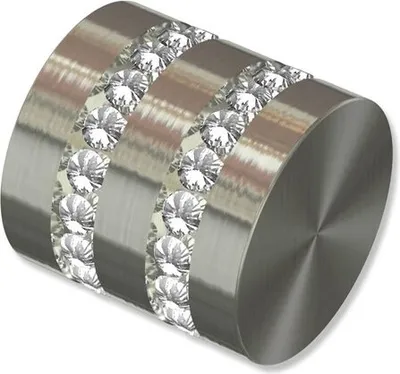 A close-up view of a decorative end cap for a curtain rod.