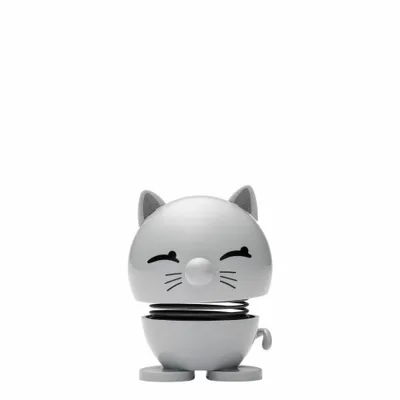 A small, light grey cat figurine with a spring in its neck, designed to wobble.