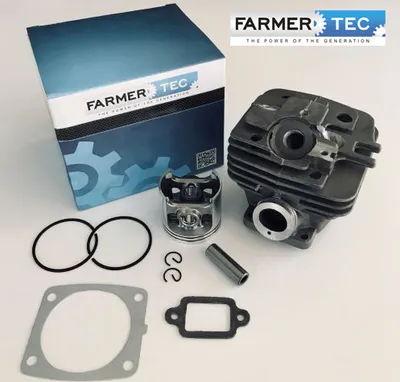 A product shot of a chainsaw cylinder and piston kit, with packaging in the background.