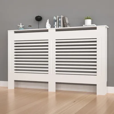 A white radiator cover with horizontal slats is shown against a gray wall and a wooden floor. Decorative items are placed on top of the cover.