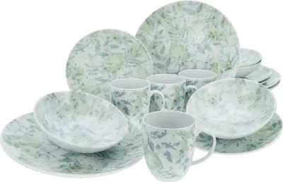 A collection of dinnerware with a botanical pattern.