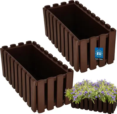 Two brown rectangular planters are shown against a white background, with one planter in the foreground and the other slightly behind and to the left. A small bunch of purple flowers is planted in the foreground planter.