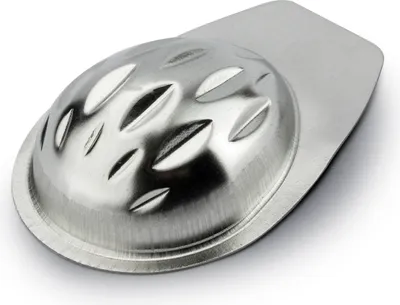 A close-up, studio shot of a single metal mold for making candies or chocolates.
