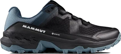 A side view of a black and blue hiking shoe.