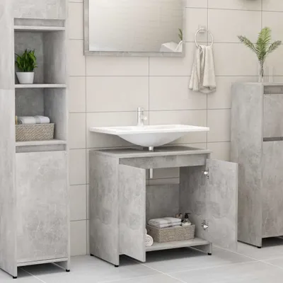 A bathroom scene with a sink and cabinets.