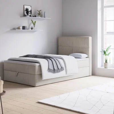 A bedroom scene with a bed, shelves, and a window.