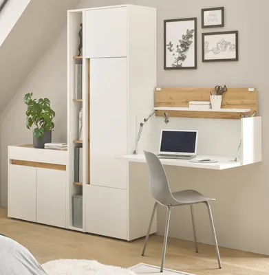 A modern home office setup with a white and wood-tone wall-mounted desk and storage unit.