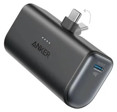A black Anker Nano power bank with USB-C connectors is shown against a white background.