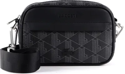 A black Lacoste crossbody bag with a geometric pattern.