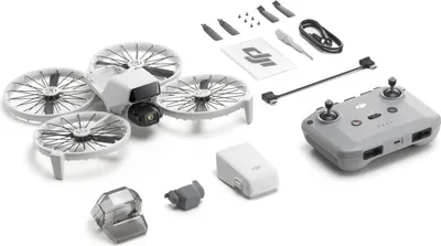 A collection of drone components and accessories laid out on a white background.
