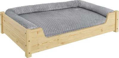 A dog bed with a wooden frame and a gray cushion.