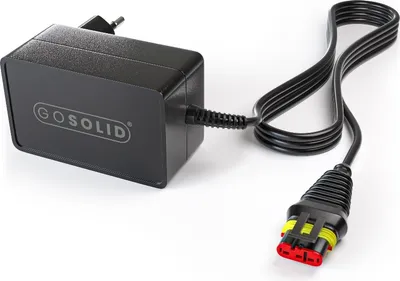 A black power adapter with a cable and connector.