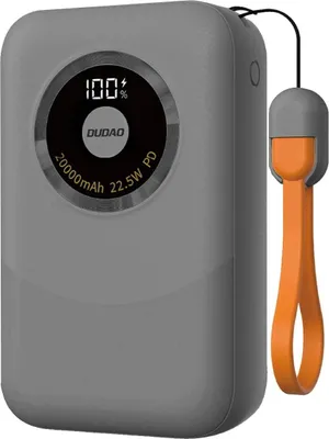 A gray power bank with an orange wrist strap is shown against a light gray background.
