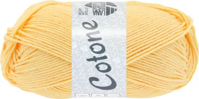 A ball of yellow yarn with a label wrapped around it.