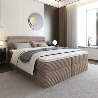 A modern bedroom with a large bed.