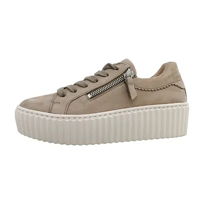 A side view of a beige women's sneaker with a platform sole.