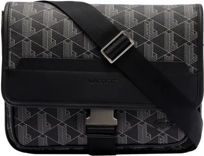 A studio shot of a black and gray monogram messenger bag with a black strap and silver buckle.
