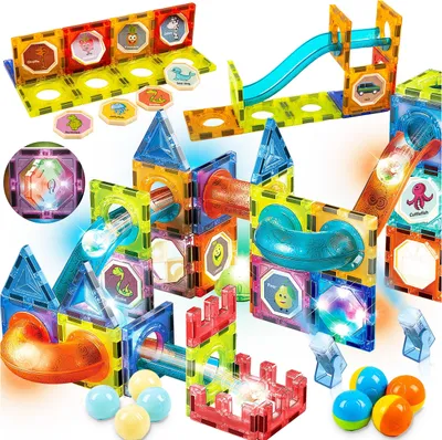 A colorful magnetic building block set with light-up tracks and balls, arranged in a playful construction.