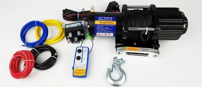 A collection of ATV winch components laid out on a white background.