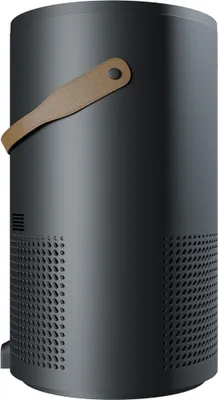 A dark gray cylindrical air purifier with a brown leather handle is shown from a side angle.