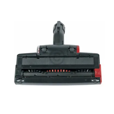 A close-up frontal view of a black and red vacuum cleaner powerhead with a brush roll is shown against a white background.