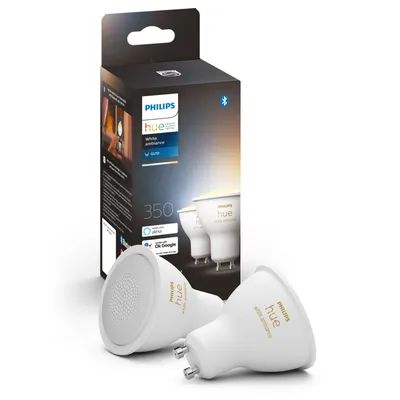 A product box for Philips Hue smart bulbs, with two bulbs in the foreground.