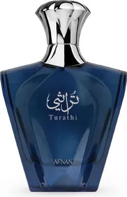 A blue glass perfume bottle with a silver cap and Arabic and English text on the front.