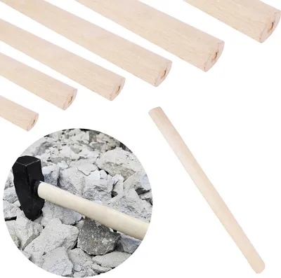 Several wooden hammer handles of varying lengths are arranged diagonally in the upper part of the image, with a sledgehammer resting on a pile of rocks in the lower left quadrant. A single wooden handle is also shown in the lower right.
