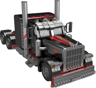 A model of a black and red semi-truck, built from interlocking bricks, is shown against a white background.